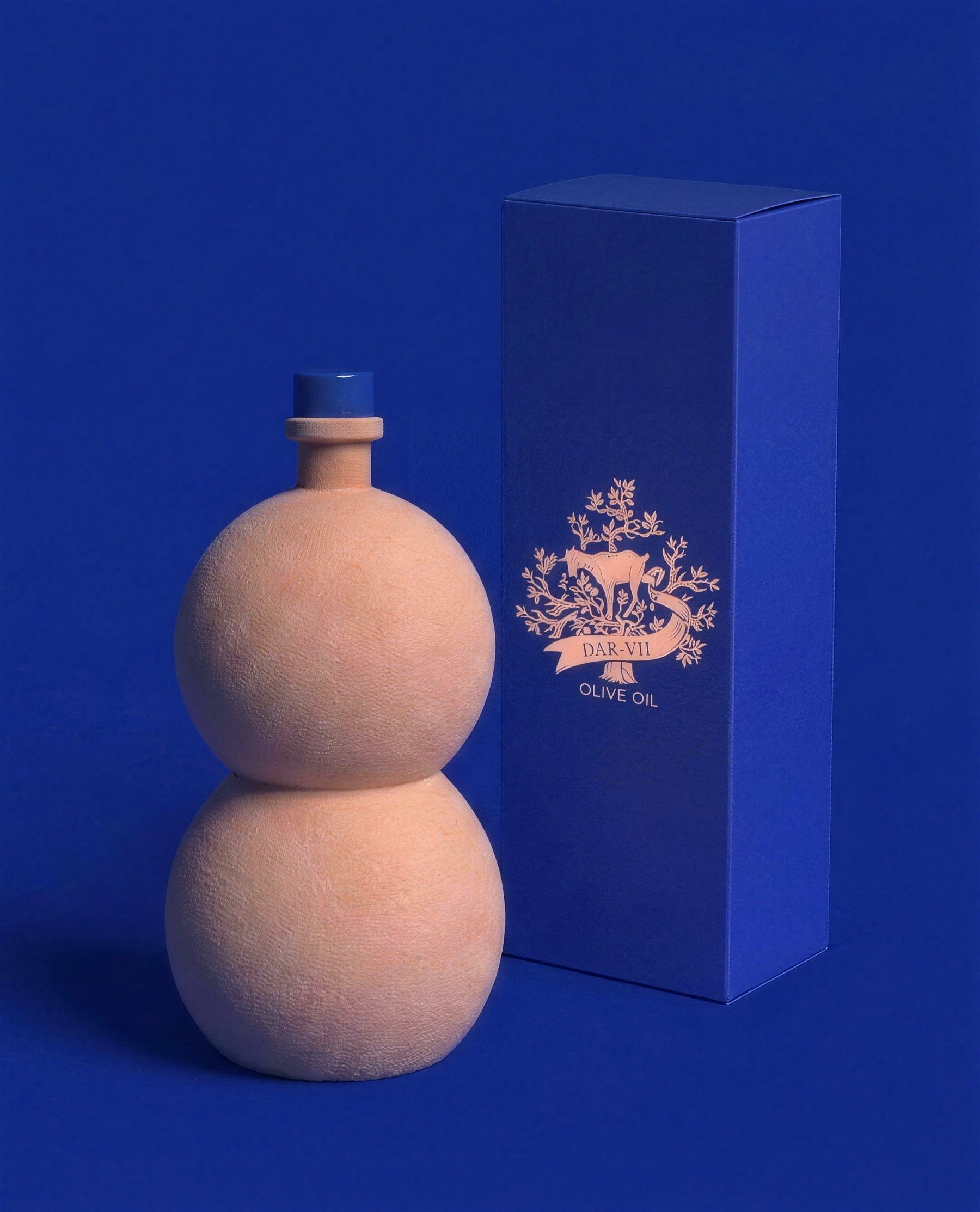 The terracotta DAR-7 bottle and presentation box on royal blue